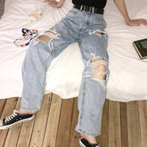 Zerrissene, lockere, lange Jeanshose mit hoher Taille